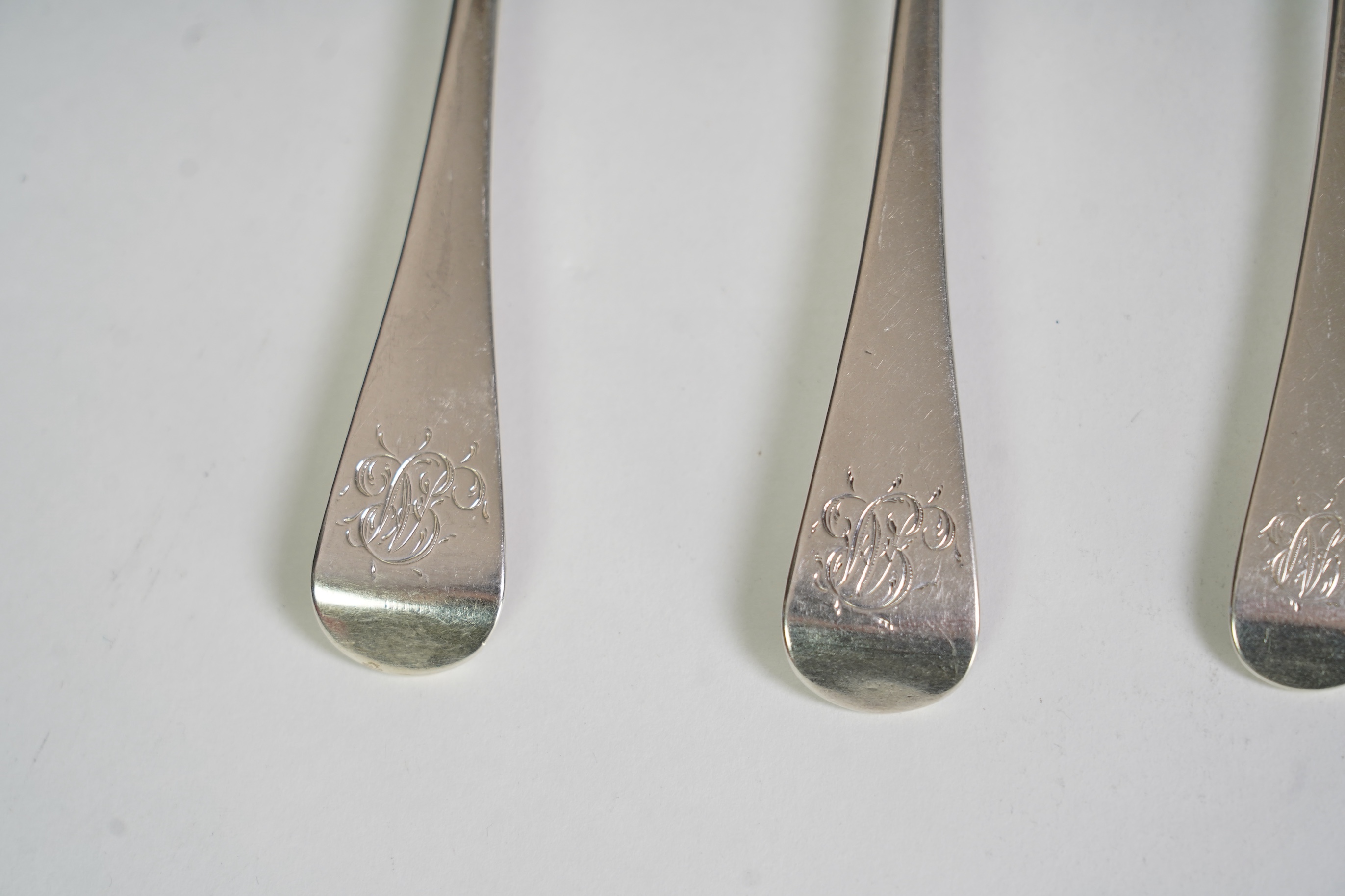 A matched part suite of George III/George IV silver Old English pattern flatware, comprising thirty seven items